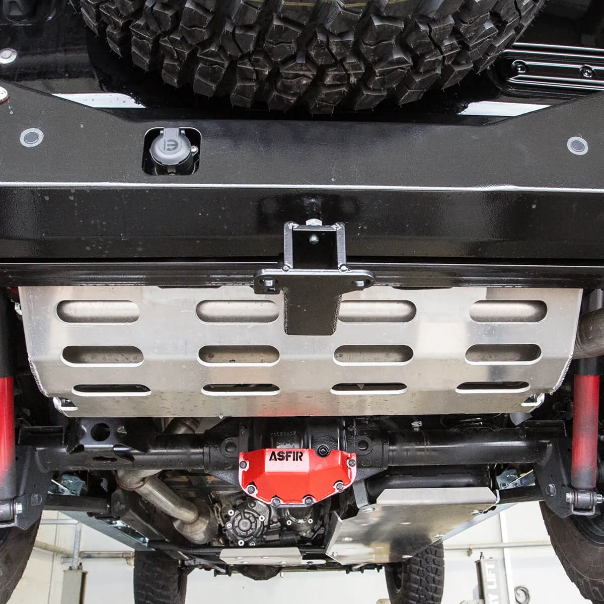 ASFIR skid plate and red differential guard under a 4Runner