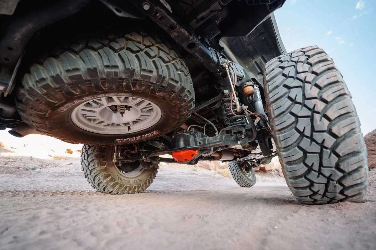 Gladiator flexing with ASFIR skid plates and red diff guard